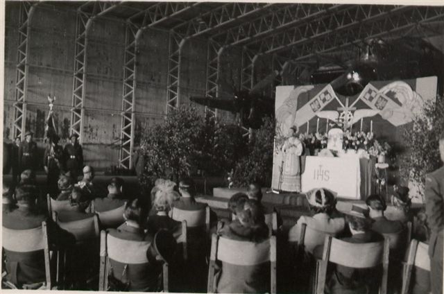 Personnel from 300 (Polish) Sqn photographed at a parade and hangar service at RAF Faldingworth on 1 Jul 1945.
