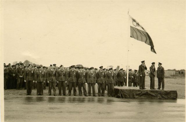 Personnel from 300 (Polish) Sqn photographed at a parade and hangar service at RAF Faldingworth on 1 Jul 1945.
