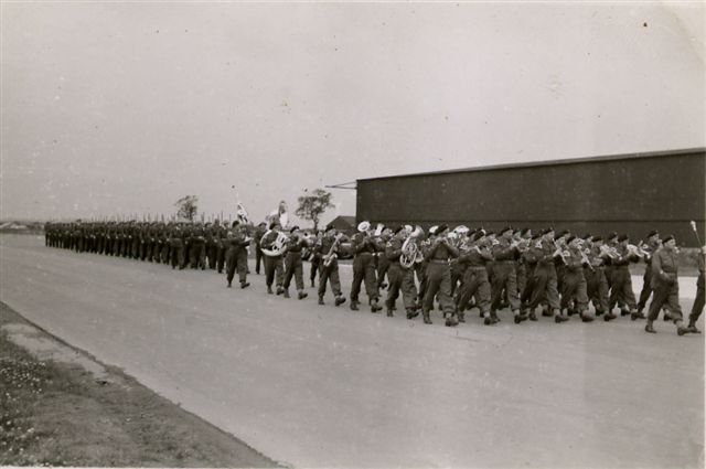 Personnel from 300 (Polish) Sqn photographed at a parade and hangar service at RAF Faldingworth on 1 Jul 1945.