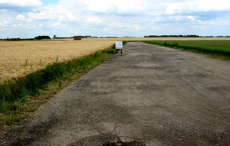 RAF Coleby Grange - Looking north from the south-west peritrack corner on the B1202 at SK999597.